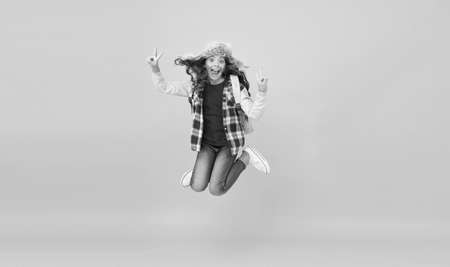 She loves holidays. Happy child enjoy school holidays. Little girl celebrate autumn holidays. Day out. Holidays or school break. Vacation. Victory celebrationの写真素材