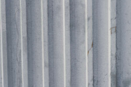 Abstract grey cement wall architectural structure with textured surface, background