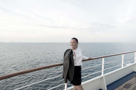 business woman or happy cute girl at shipの写真素材