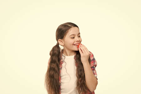 Be simply beautiful. Little beauty isolated on white. Small girl put lip balm. Lip care. Face beauty...