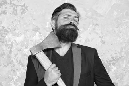 Good beard needs good blade. Bearded man hold axe blade. Beard grooming tool. Cutthroat beard shaving. Skincare. Haircare. Barbering. Barbershop. Beard barberの写真素材