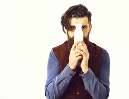 bearded man holding bottle of kefir with serious faceの写真素材