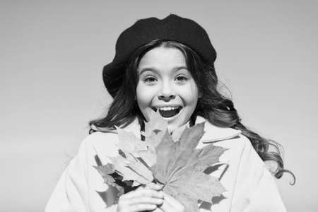 Everyday winner. happy small girl. autumn kid fashion. child maple leaf. kid in french beret. favorite season. good weather mood. parisian girl trendy look. school time. maple syrup. what a surpriseの写真素材