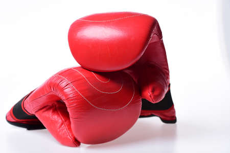 Boxing gloves in red color isolated on white backgroundの写真素材