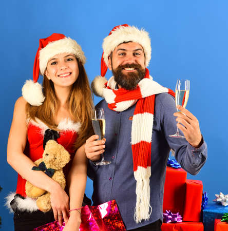 Man with beard and woman with cheerful faces on blueの写真素材