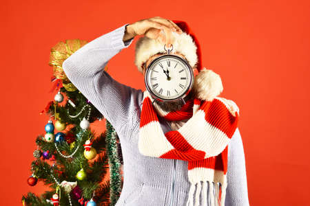 Santa near decorated fir tree. Man with scarfの写真素材