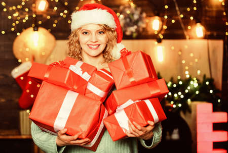 winter holidays and vacation. Christmas shopping. girl in santa hat present box. merry christmas....