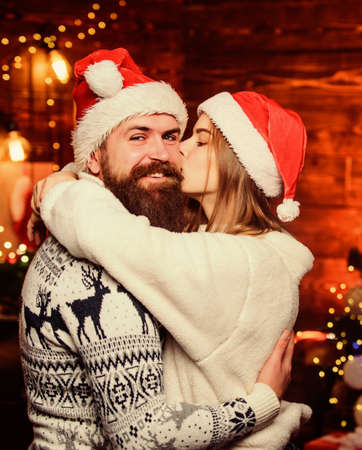 Feast of Christmas. happy new year. xmas gifts. merry christmas. winter holidays. Seasonal shopping sales. santa family together. Loving couple xmas tree. couple in loveの写真素材