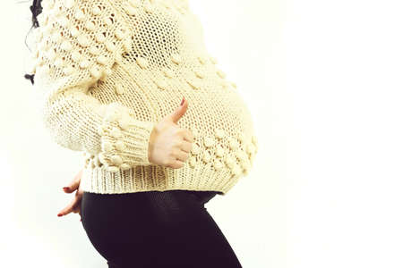 female hands of pregnant woman showing cool