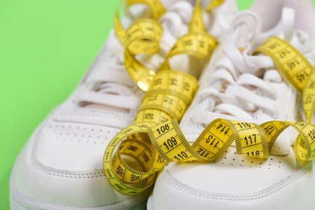 Sport shoes and measurement background.の写真素材