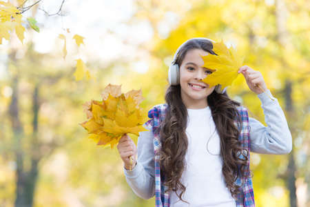 fresh air. online education. childhood happiness. beauty and nature. happy kid wear headphones. teen...
