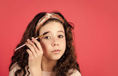 Female products. Love my face. Girl teen with long curly hair. Beauty routine. Natural organic cosmetics. Healthy skin. Acne problem. Girl in beauty salon. Makeup for kid. Health and beautyの写真素材