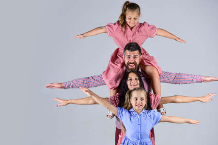 having fun together. happiness. happy fathers day. family holiday. mom and dad with daughters. love and trust. Father and mother with two daughters. mothers dayの写真素材