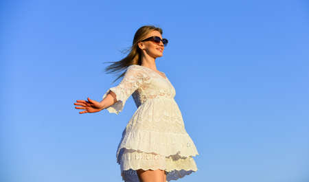 Freedom. Impulsiveness and ease. Naturalness concept. Dancing woman. Mental health. Girl blue sky...