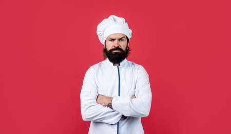 handsome hipster with beard and moustache crossed hands, culinary