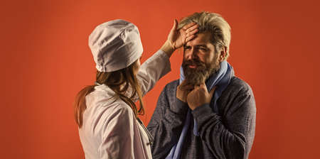 physician talk to patient. doctor examining patient. first symptoms of flu or virus. prescribe bed rest. nurse write out sick leave. virus screening.の写真素材