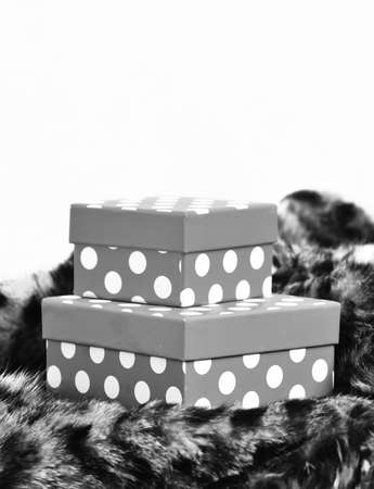 Colorful gift boxes on fur coatの写真素材