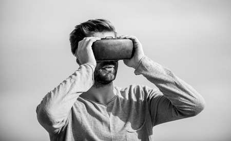 Man wear wireless VR glasses headset. Use modern technology. Virtual reality goggles. Digital future and innovation. Engineering project. Augmented reality. Virtual reality. Cyber space. Game onlineの写真素材