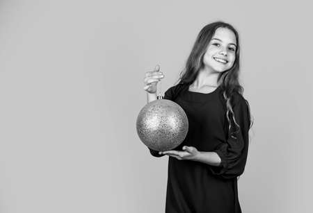 christmas tree decoration. small girl smiling with xmas decor. holiday decor shop. preparation for new year party. holiday celebration. decorate your christmas. childhood happiness. copy spaceの写真素材