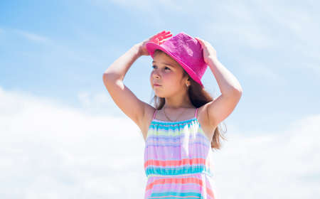 Cool and cute. perfect summer day. kid beauty and fashion. hairdresser beauty salon. childhood happiness. little fashion model. small girl wear dress. child relax outdoor. looking so stylishの写真素材