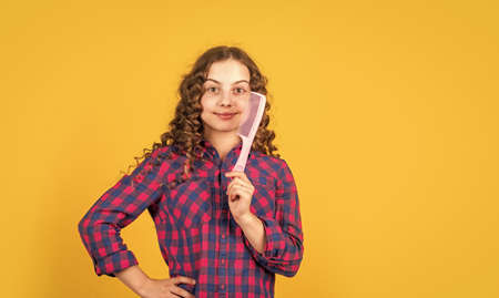 happy girl with hair brush. healthy and strong hair. hairdresser beauty salon. kid brushing curls....