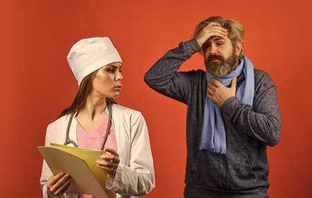 Nurse visiting unhealthy man at home. Cold flu symptoms. Virus epidemic. Sick patient. Doctor...