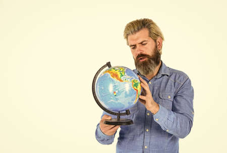 Pick next destination point. Travel and wanderlust. Bearded man with globe. Ecology problem. Earth day. Global and international concept. Protect Earth. Eco movement. Geography teacher. Earth globeの写真素材