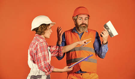 Couple planning changes renovation apartment. Sign contract with workers. Discussing renovation with...