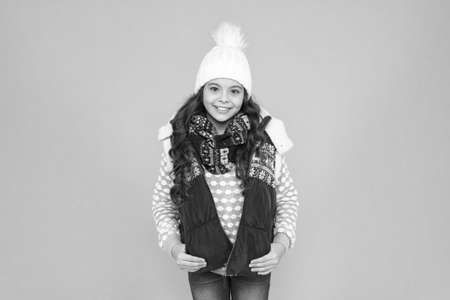 Staying beautiful any season. kid wear knitted warm clothes. winter vibes. Portrait of happy girl hipster. Youth street fashion. Winter fun. feeling good any weather. Stay active this seasonの写真素材
