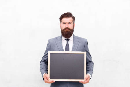 Professional academy. Businessman hold school blackboard. Business education. Study business. Education and study. Education course. Online education. Learn anytime anywhere, copy spaceの写真素材