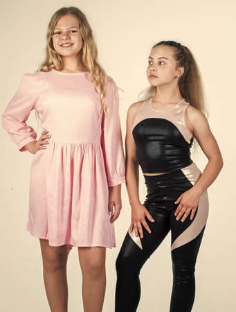 beauty and fashion. two teen girls on high heels. sisterhood concept. beautiful fashion models...