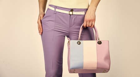 versatile handbag colors. sexy and confident blond carry shoulder bag. handbag fashion and beauty. tote or shopper bag for any occasion. woman use leather clutch. girl wear violet pantiesの写真素材