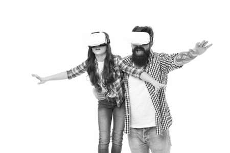 sense of freedom. feel free in glasses of virtual reality. future technology concept. daughter and dad in wireless vr headset. modern education at home. play virtual game together. family having funの写真素材