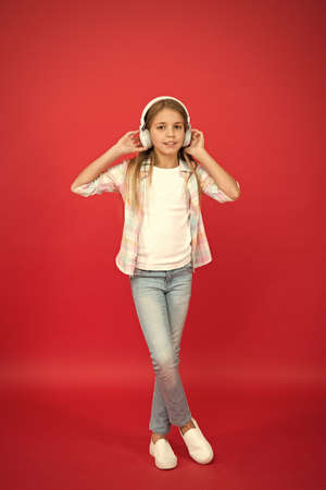 enjoying the melody. summer vacation. School child listening loud music. happy kid in wireless...