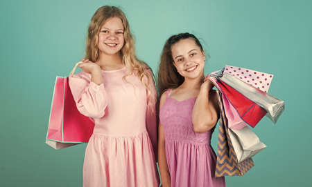 Thanks for your purchase. kids on cyber monday. big sale. teen girls hold paper bag. buy gifts for...