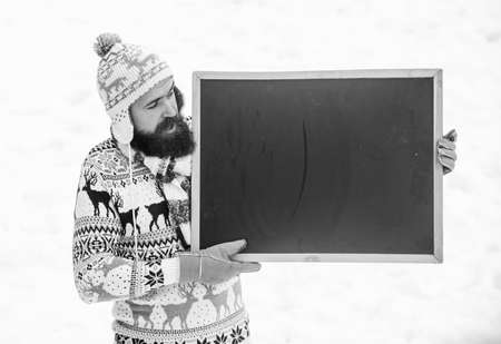 information. winter holiday. Party here. man advertising board. Copy space. happy hipster with...
