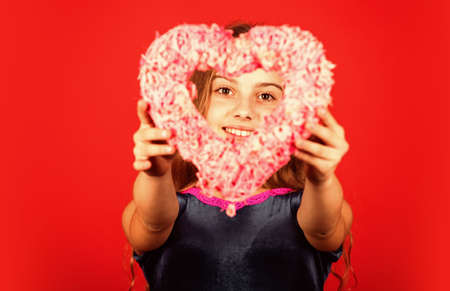 Heart shaped decor valentines day. Feeling loved. Lovely baby. Adorable girl having fun. Romantic...