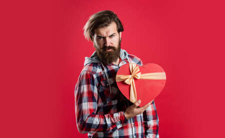 Forever love. be my valentine. brutal mature hipster hold heart box. perfect gift for her. bearded man express love. love holiday. male go shopping. boxing day concept. valentines day presentの写真素材