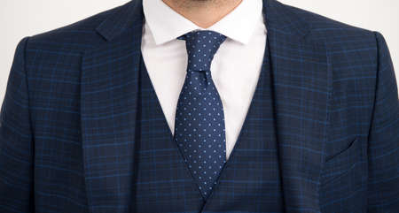 Tie goes inside vest. Vested three-piece suit worn with tie. Necktie collection. Fashion accessory....