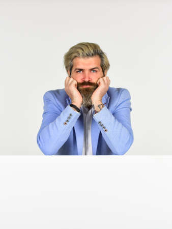 Goods for men. Business man wearing formal clothes stand behind banner. Businessman lean on copy space surface. Commercial banner. Advertisement marketing and promotion. Portrait of businessmanの写真素材