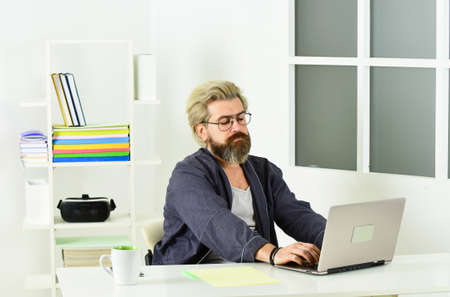 Unemployed man looking for jobs online. Create resume. Job Interview. Vacancy. Unemployed guy surfing internet. Easy to get sidetracked. Explore labor market. Financial crisis. Unemployment conceptの写真素材