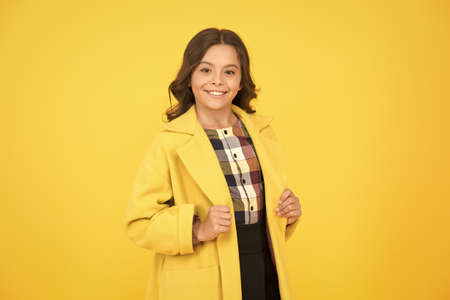 Yellow mood. Girl fashionable cute model wear yellow wool coat. Personal styling and bespoke...