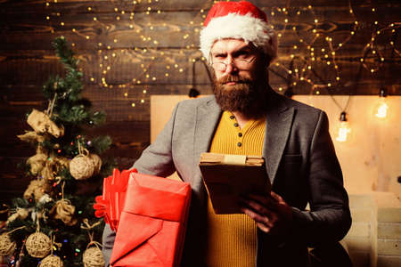 Post for santa claus. Letter for santa claus. Man bearded with eyeglasses reading post for santa....