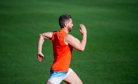 Everything is possible. fitness training outdoor. runner run fast on running track. energetic and...
