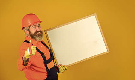 male construction worker. copy space. planning new project. man with presentation. Builder with...
