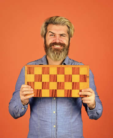 Teacher chess competition. Chess figures. Game strategy concept. Board game. Man playing chess. Intelligent bearded hipster. Cognitive skills. Hobby and leisure. Intellectual games. Chess lessonの写真素材