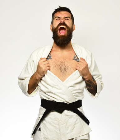 Karate man with angry face in uniform. Oriental sports concept.の写真素材