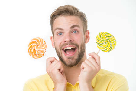 Impressing fact sugar nutrition. Man handsome bearded guy holds lollipop candy. Man with lollipop...
