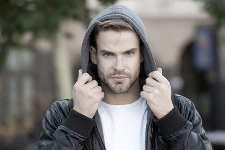 Fashion for autumn chill. Handsome man wear hooded fashion jacket. Young guy in autumn style outdoor. Mens fashion trends and seasonal style. Fashion wardrobe for fallの写真素材