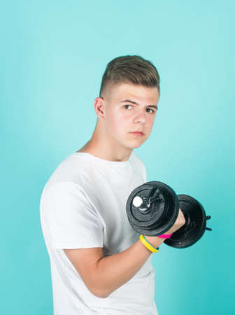 Little break. sport and fitness. teen guy hold dumbbell. sportswear and equipment shop. healthy...